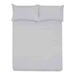 A bed made up with white sheets and pillows.