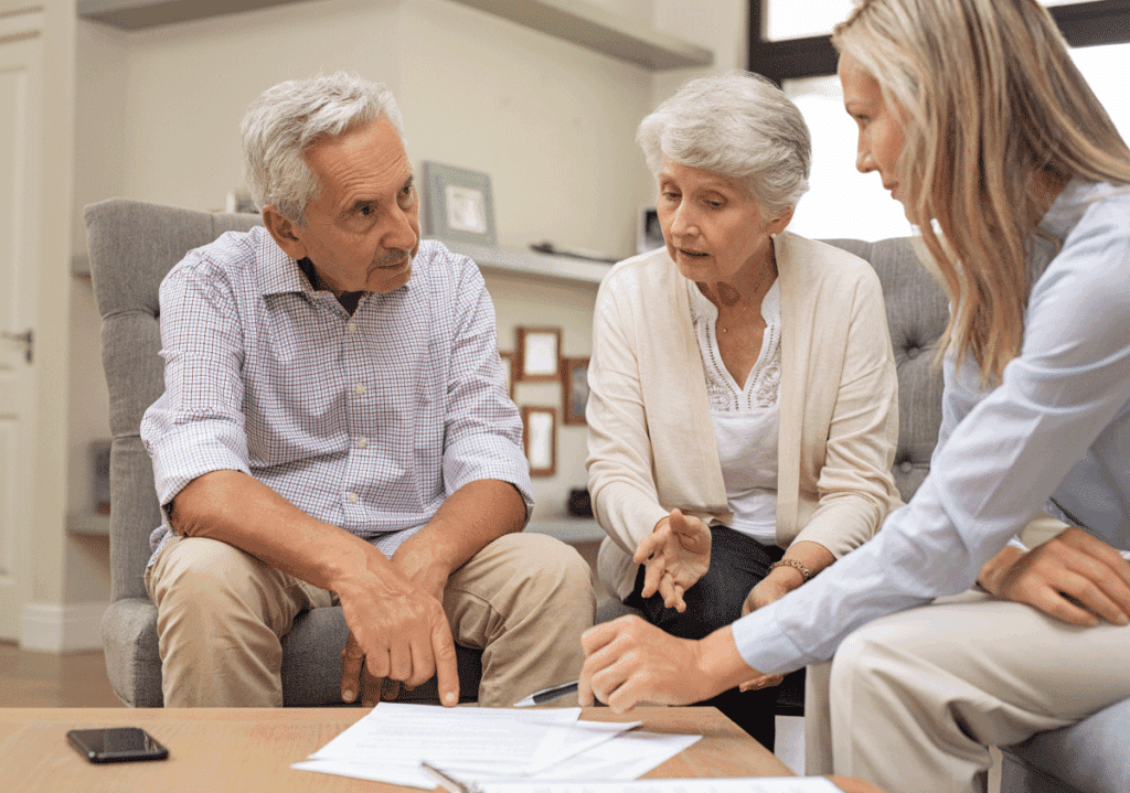 Elderly patients meeting with a respiratory therapist to review insurance coverage for portable oxygen equipment.