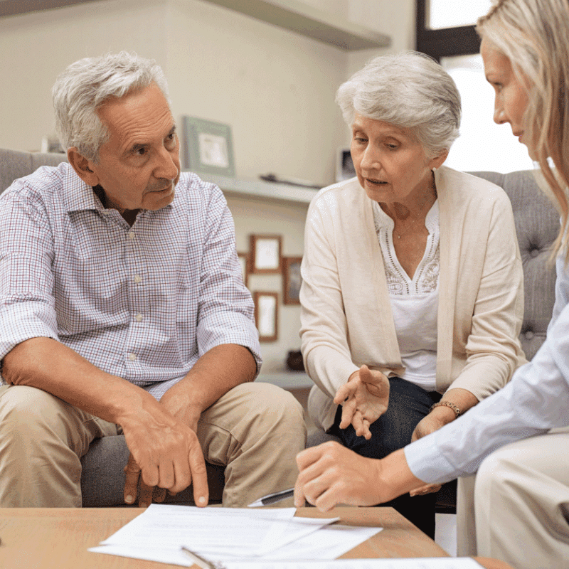 Elderly patients meeting with a respiratory therapist to review insurance coverage for portable oxygen equipment.